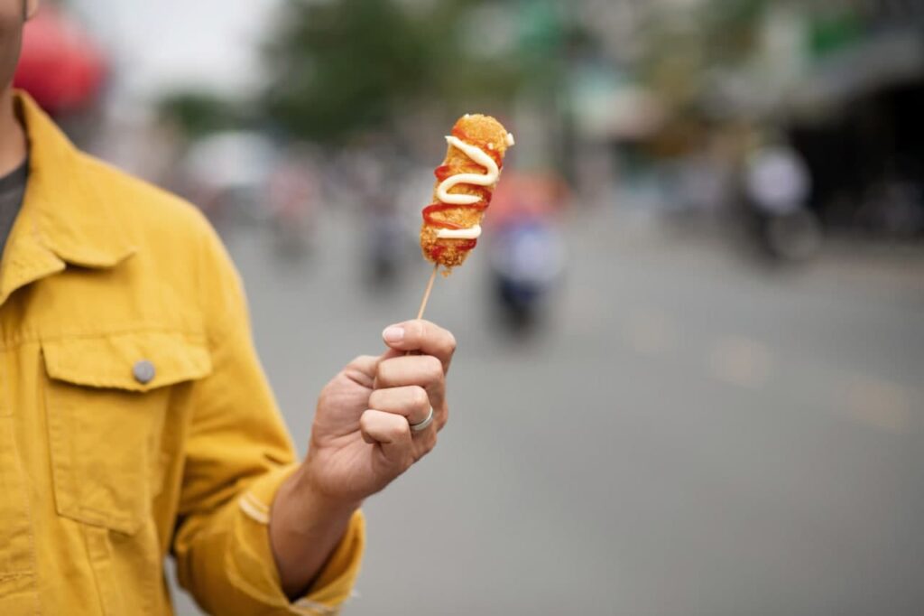 Man Holding Korean Corn Dog