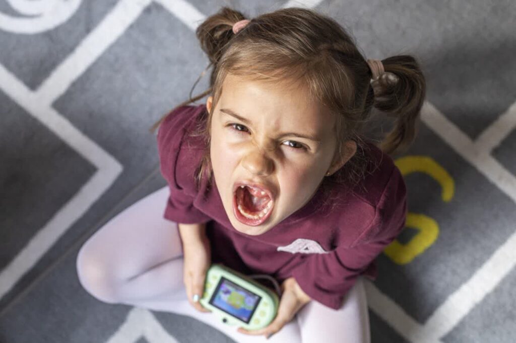 Stubborn child using Phone